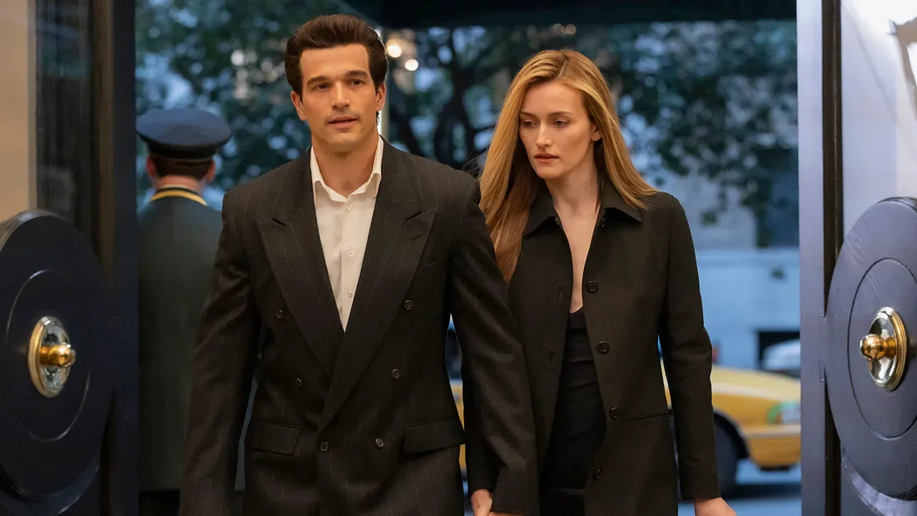 Sarah Pidgeon as Carolyn Bessette and Paul Anthony Kelly as John F. Kennedy Jr. on a New York street in Love Story (TV series, 2026)