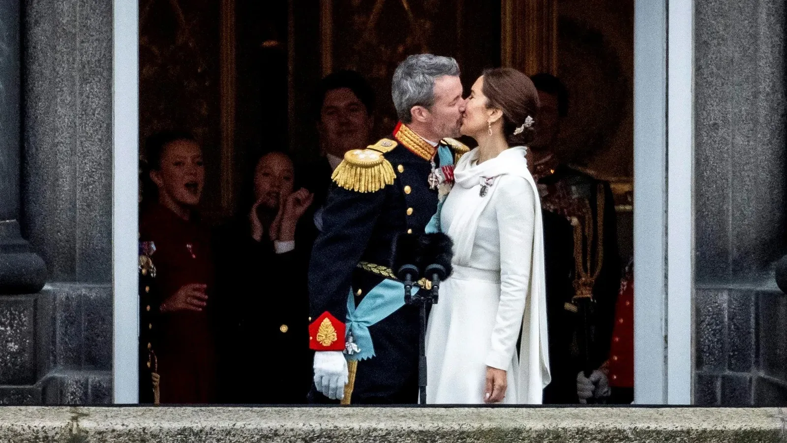 Queen of Mary and her husband King Frederik X kiss on the balcony, on the coronation day, 14 January 2024