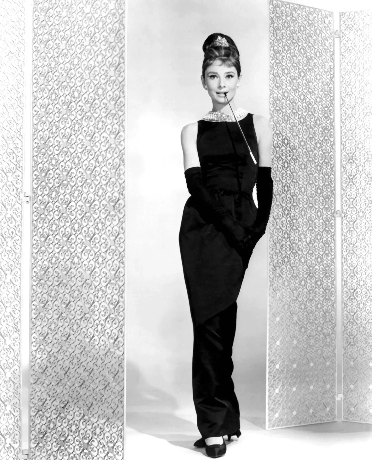Audrey Hepburn in the black Givenchy dress and opera gloves, publicity photo for Breakfast at Tiffany's (film, 1961)
