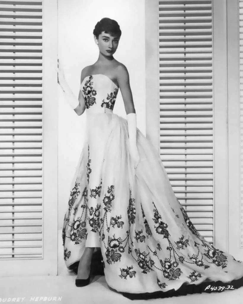 Audrey Hepburn in a strapless white gown embroidered with black flowers, Sabrina (film, 1954)