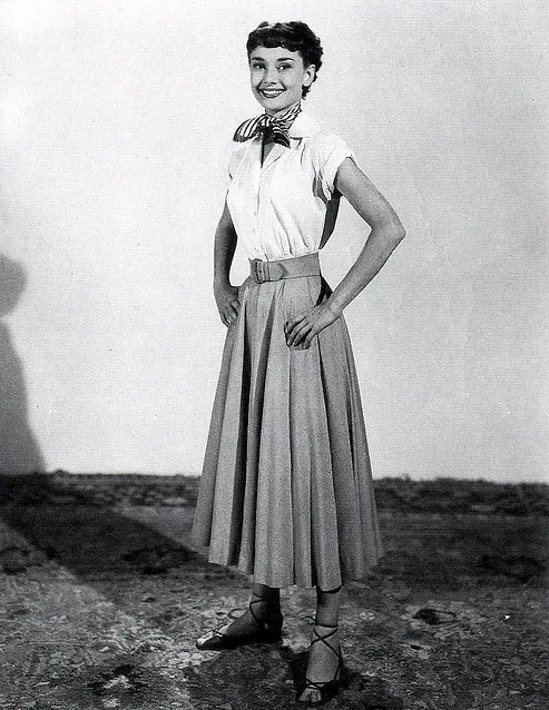 Audrey Hepburn in a white shirt and circle skirt, full-length photo for Roman Holiday