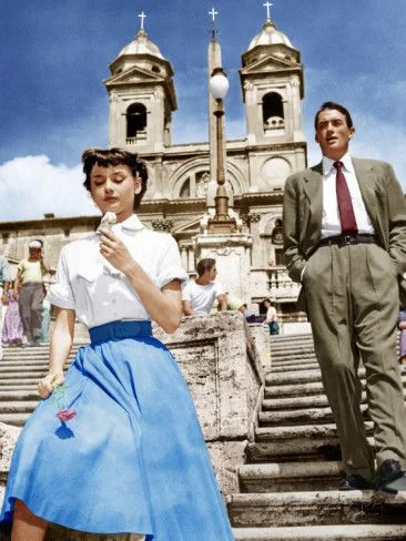 Colorized photo of Audrey Hepburn in a blue skirt on the Spanish Steps, Roman Holiday