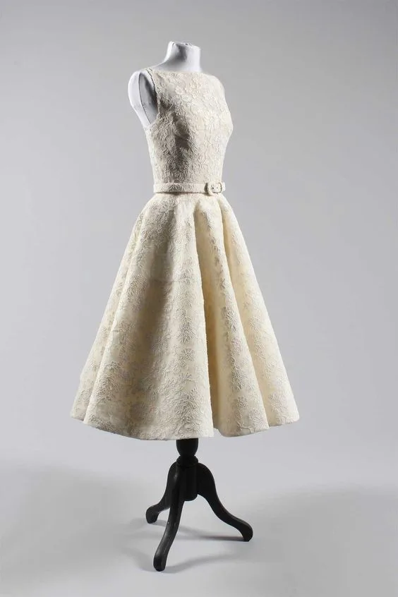 Audrey Hepburn's white lace Oscar dress of 1954 on a stand