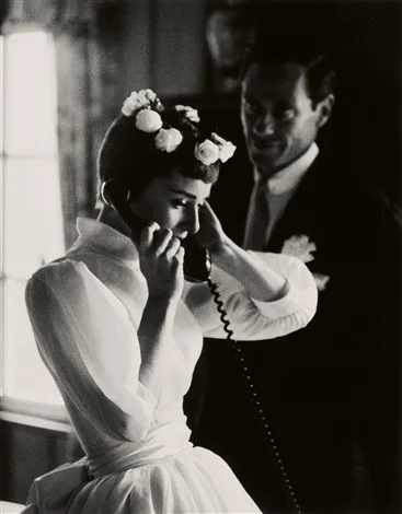 Audrey Hepburn in her flower crown and high-collared wedding dress, 1954