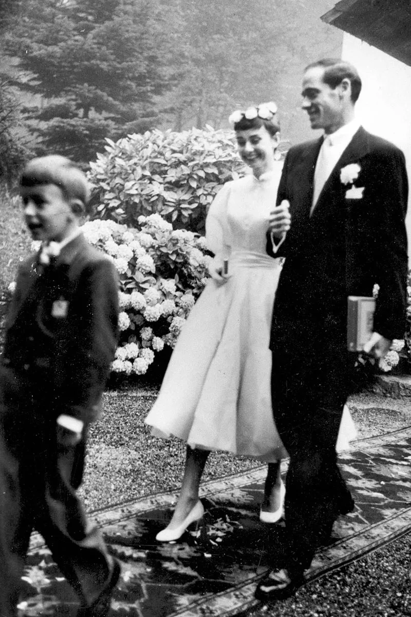 Audrey Hepburn and Mel Ferrer walking after their wedding, Bürgenstock, 1954