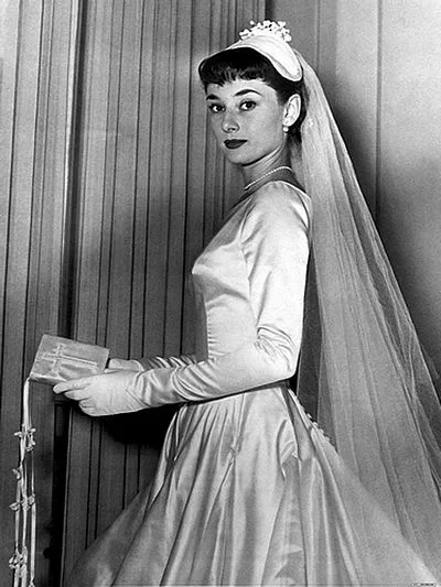 Audrey Hepburn in her Sorelle Fontana wedding dress and veil, 1952
