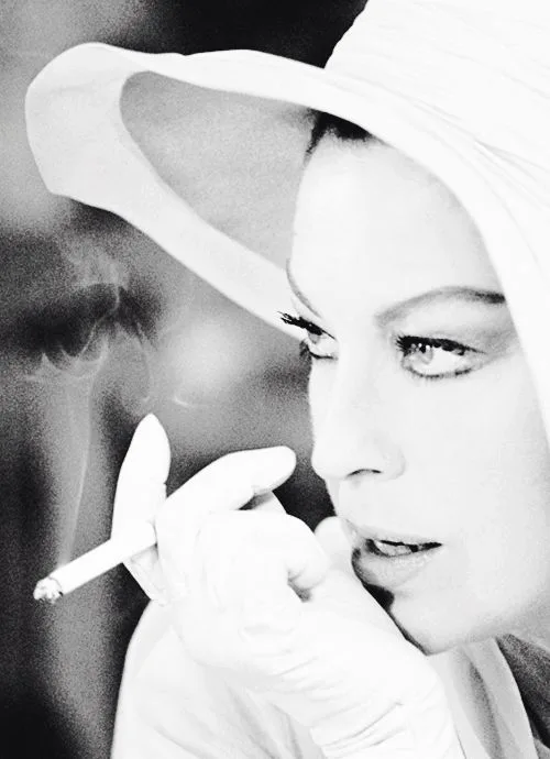 Ava Gardner in a wide white hat with a cigarette, 1950s