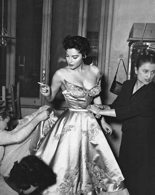 Ava Gardner at a fitting for a Balenciaga gown