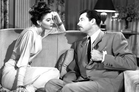 Ava Gardner on a sofa with a co-star in She Went to the Races (film, 1945)