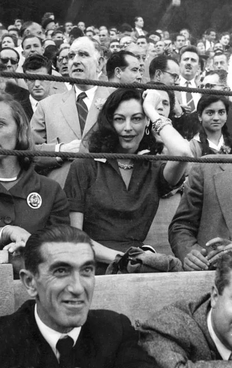 Ava Gardner in the crowd at a bullfight in Spain