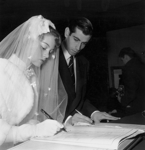 Brigitte Bardot in her wedding dress and veil leaving the church with Roger Vadim, 1952