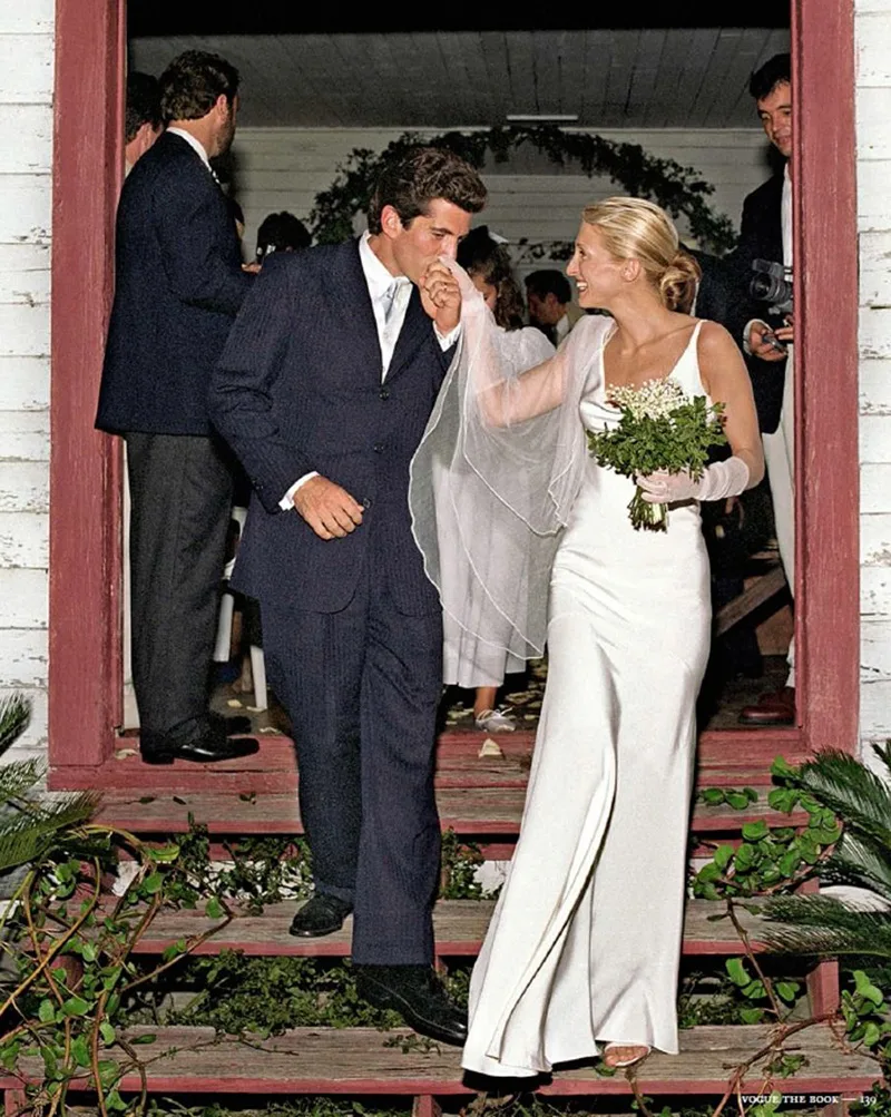 Carolyn Bessette in her Narciso Rodriguez slip dress and veil leaving the church with John F. Kennedy Jr., Cumberland Island, 1996