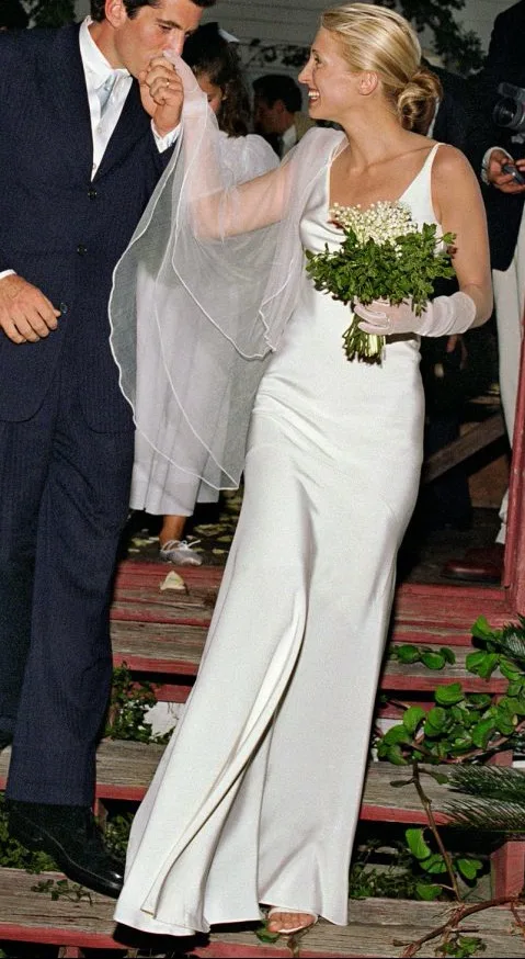 John F. Kennedy Jr. kissing Carolyn Bessette's hand on the church steps, Cumberland Island, 1996
