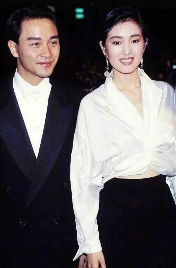 Gong Li in a white shirt with Leslie Cheung in a black dinner suit, Cannes, 1993