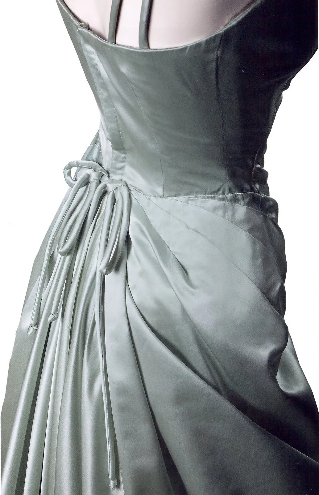 Close view of the draped skirt and bow at the back of Grace Kelly's ice-blue satin Oscar gown