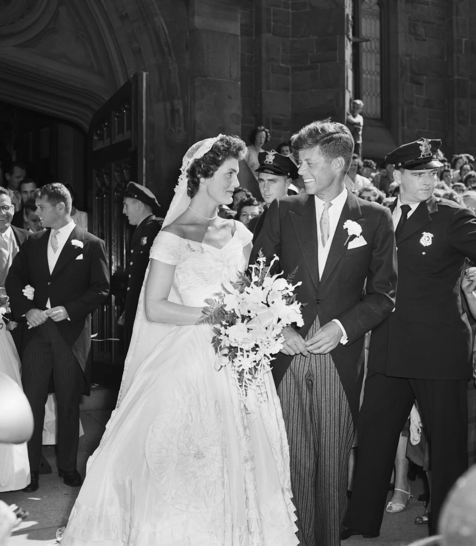 Jacqueline Bouvier and John F. Kennedy outside St. Mary's Church, Newport, 1953