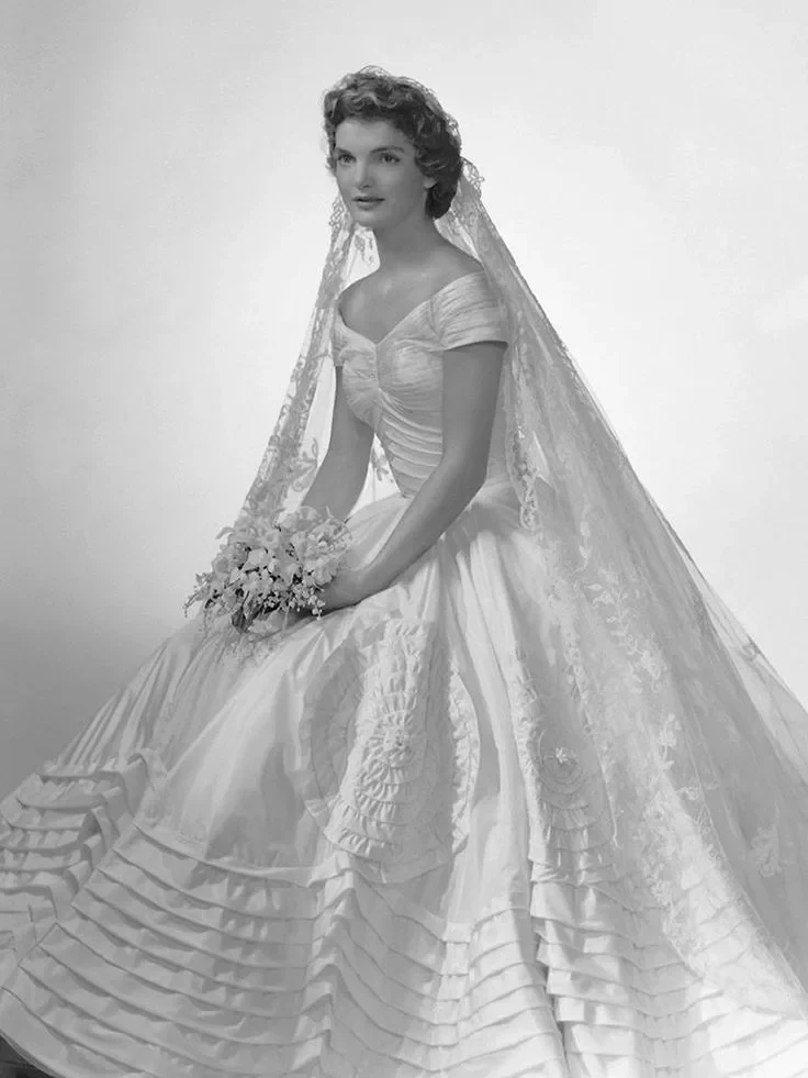 Bridal portrait of Jacqueline Bouvier in her ivory silk taffeta wedding dress by Ann Lowe, 1953