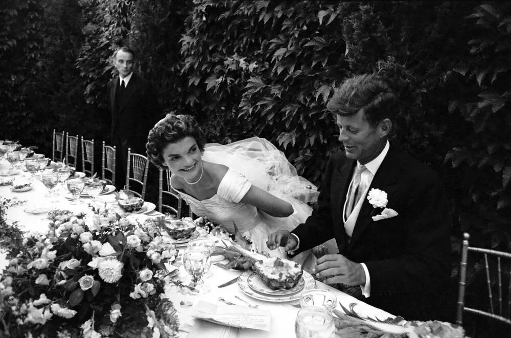 Jacqueline Bouvier and John F. Kennedy at their wedding table, 1953