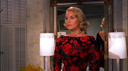 Eva Marie Saint as Eve Kendall in a black rose print dress in North by Northwest (1959)