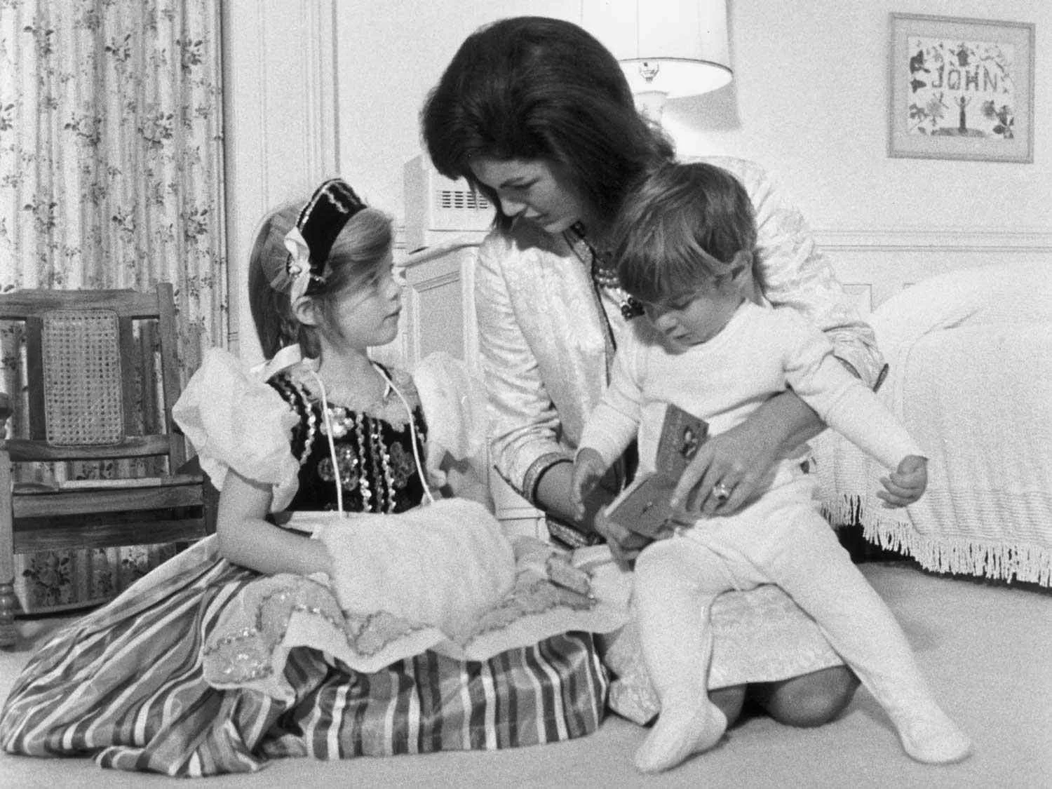 John F. Kennedy Jr. as a child with his mother Jacqueline Kennedy and his sister Caroline Kennedy in the 1960s