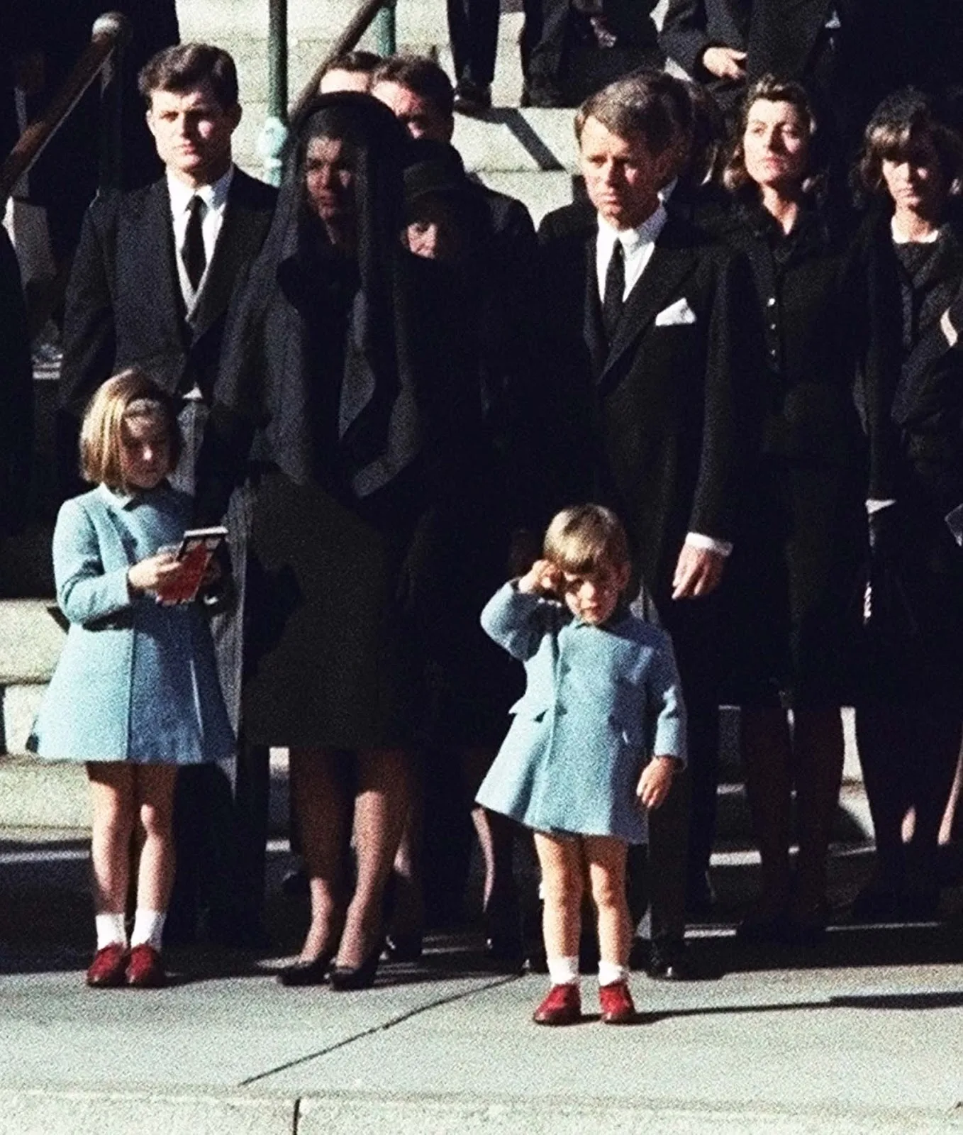 John F. Kennedy Jr. saluting his father's coffin outside St. Matthew's Cathedral, Washington, on his third birthday, 25 November 1963