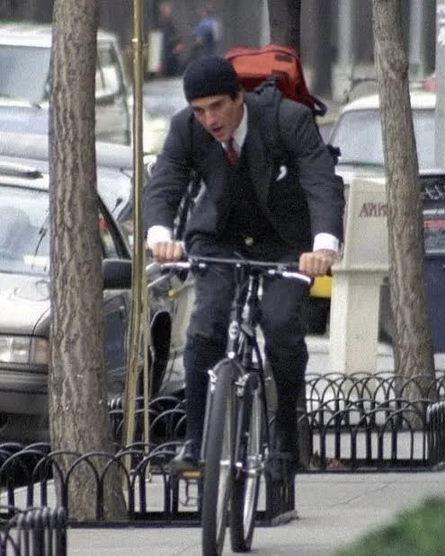 John F. Kennedy Jr. riding a bicycle in Manhattan in the 1990s