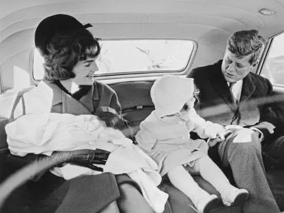 John F. Kennedy Jr. as a baby with his father John F. Kennedy, his mother Jacqueline Kennedy and his sister Caroline Kennedy, 1960