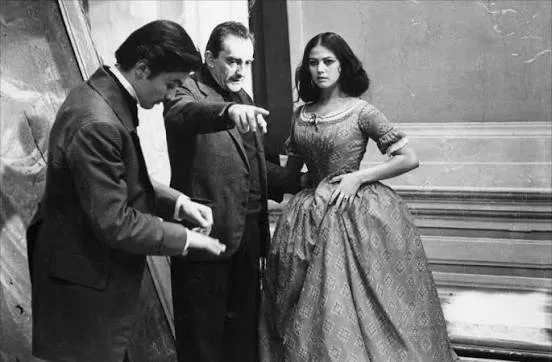 Luchino Visconti with Alain Delon and Claudia Cardinale on the set of film The Leopard (1963)