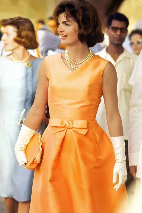 Jacqueline Kennedy wore an apricot silk ziberline dress designed by Oleg Cassini in Udaipur, India, 1962
