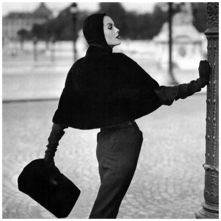 Anne St Marie in a seal skin slip cover cape by Pierre Balmain, Photo by Henry Clarke,1955 for Vogue