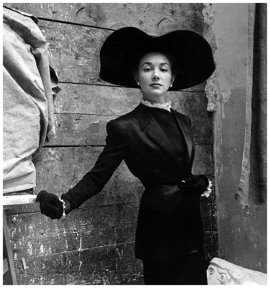 Model in suit by Balmain and hat by Legroux, photo by Clifford Coffin for British Vogue, April 1947