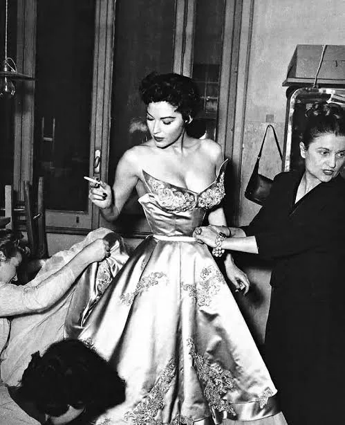 Ava Gardner with Micol Fontana of the Sorelle Fontana couture house in Rome, 1954