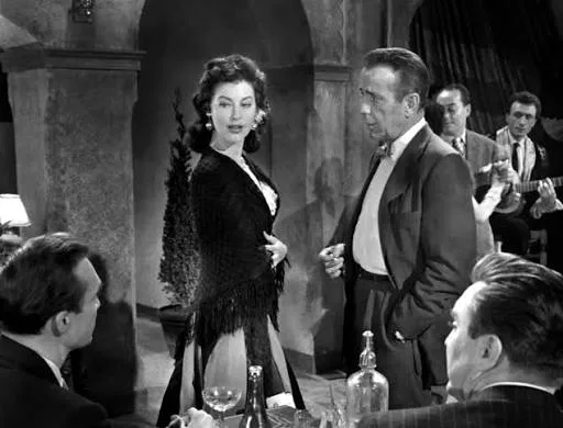 Humphrey Bogart, Warren Stevens, Edmond O'Brien and Mari Aldon at the Madrid nightclub in The Barefoot Contessa (film, 1954)