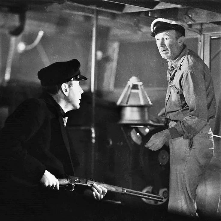 Humphrey Bogart as Harry Morgan and Walter Brennan as Eddie in To Have and Have Not (film, 1944)